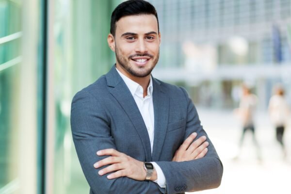 personal loan agent in a suite is smiling
