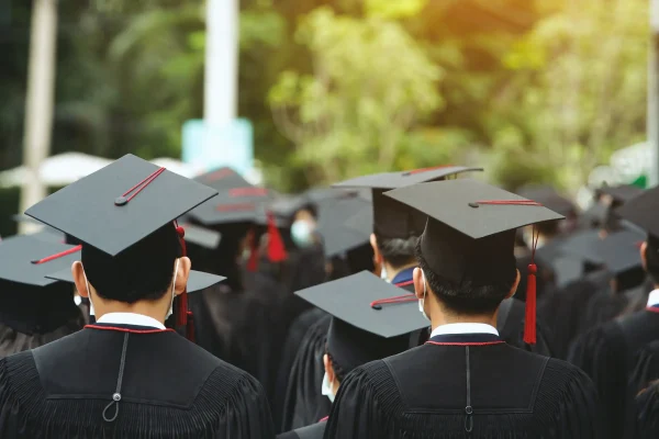 students in the degree convocation with black aprons